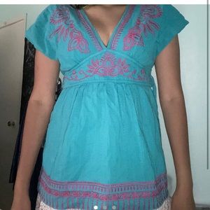 Super cute blue and pink peplum style top.